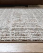 Fuadwick 5'3" x 7' Area Rug