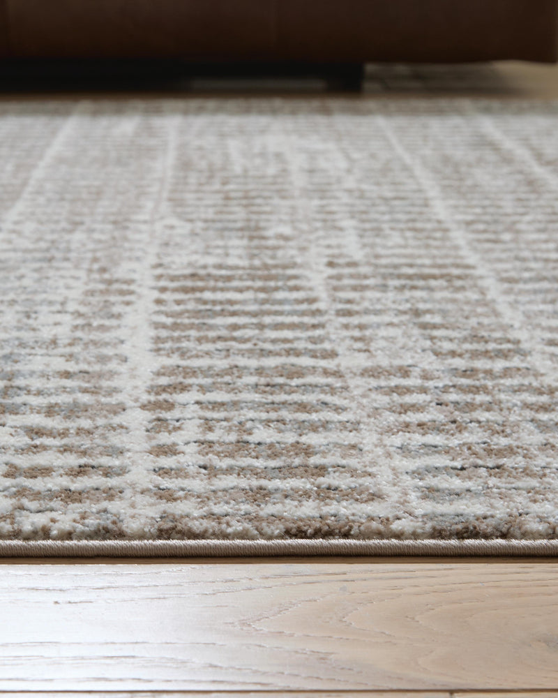Fuadwick 5'3" x 7' Area Rug